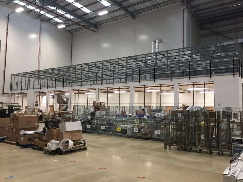 mezzanine floor in warehouse with mesh panelling