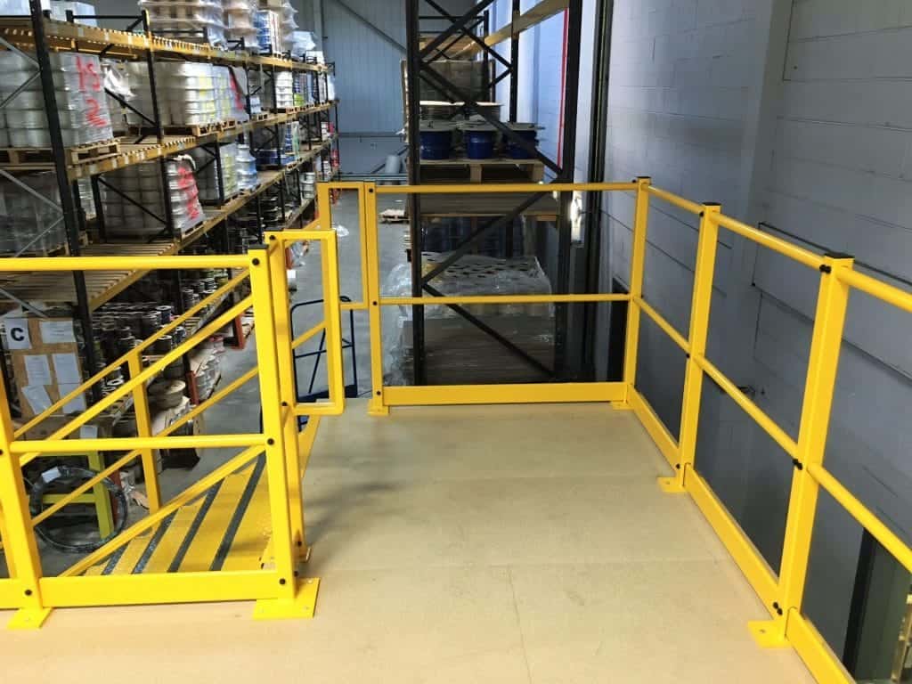 mezzanine floor in warehouse with yellow edge protection