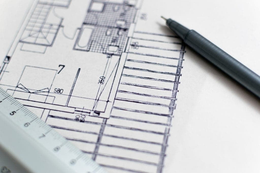 close up of printed drawing with pen and ruler