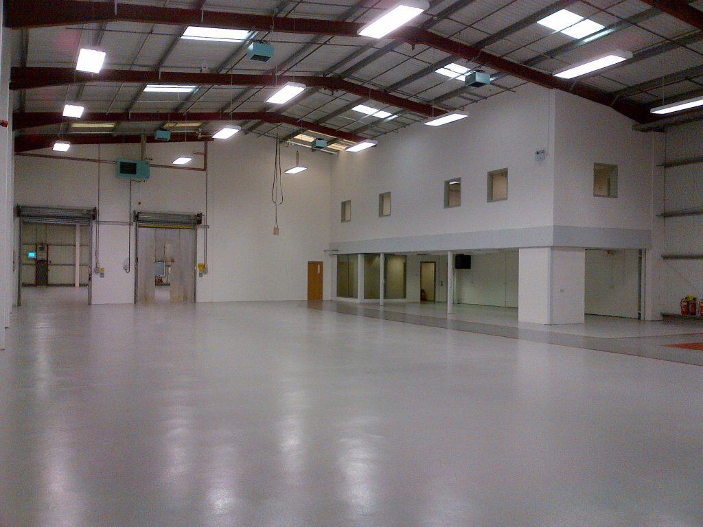 empty warehouse with mezzanine floor for office use