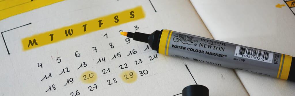 printed calendar and marker pen