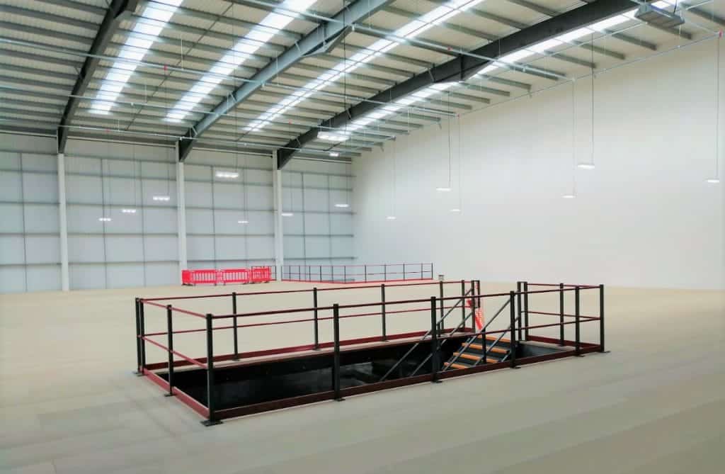 large empty mezzanine floor in warehouse building