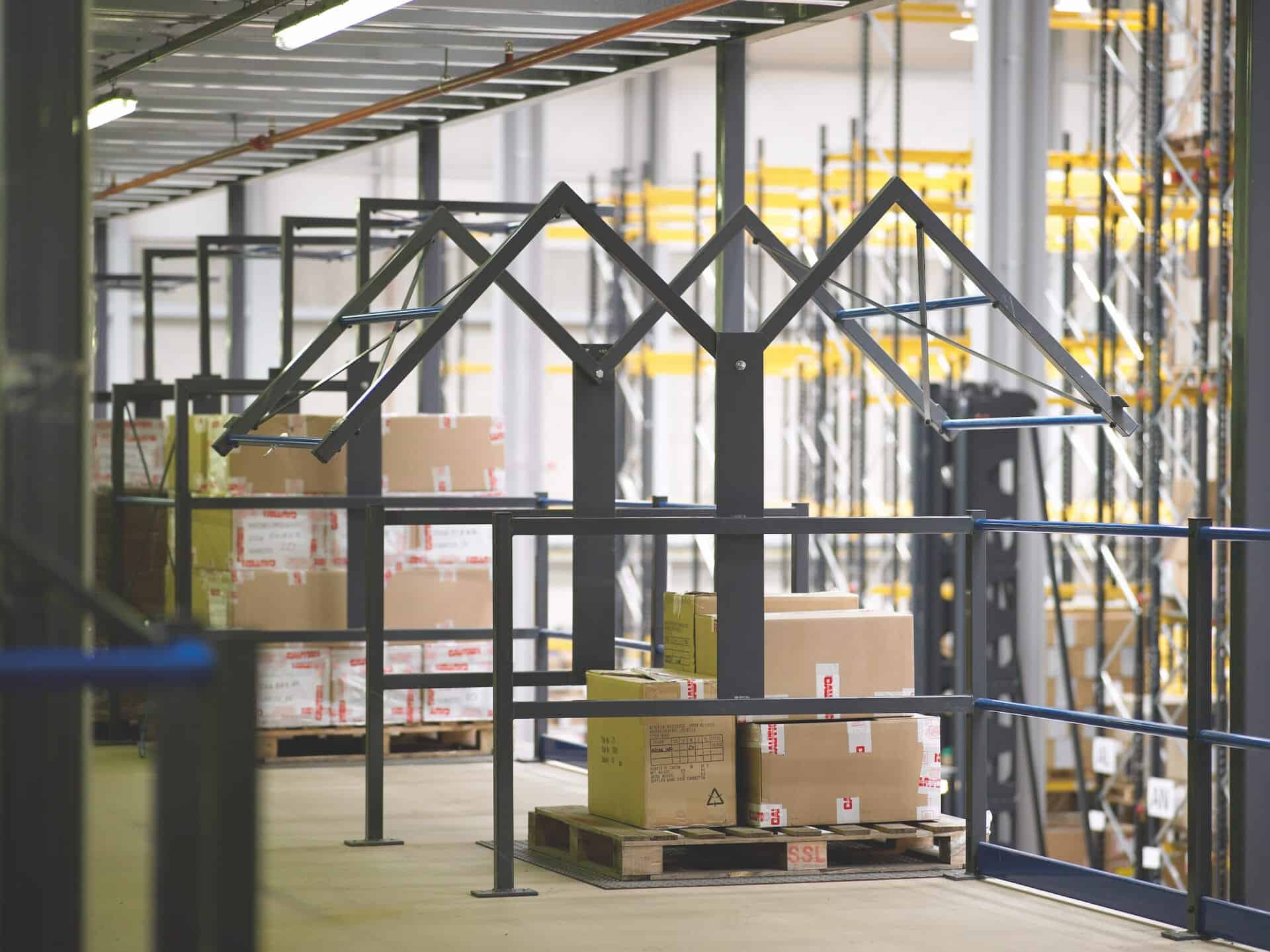 mezzanine floor pallet gate containing pallet of boxes