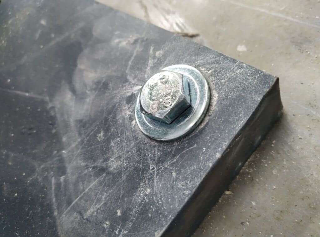 close up of bolt in mezzanine floor column base plate