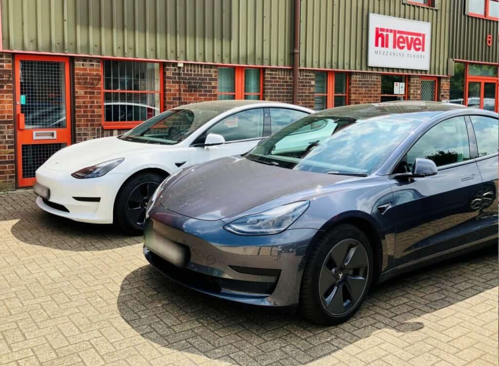 two tesla cars outside Hi-Level office