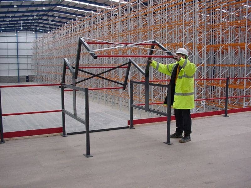 person using pallet gate on mezzanine floor