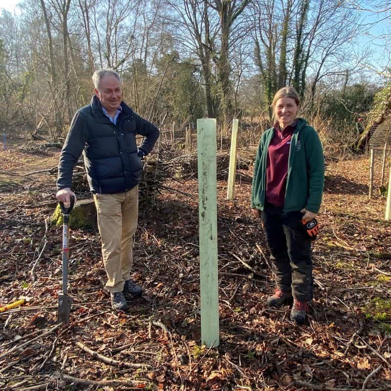 two people at tree planting site