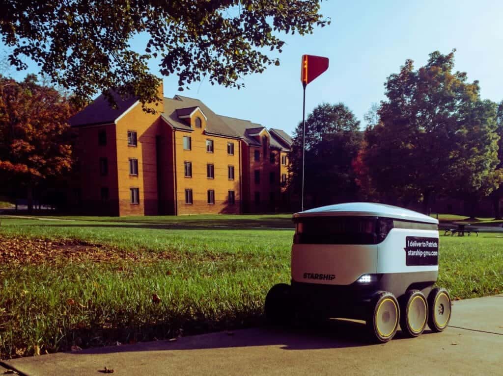 delivery robot on footpath outside building