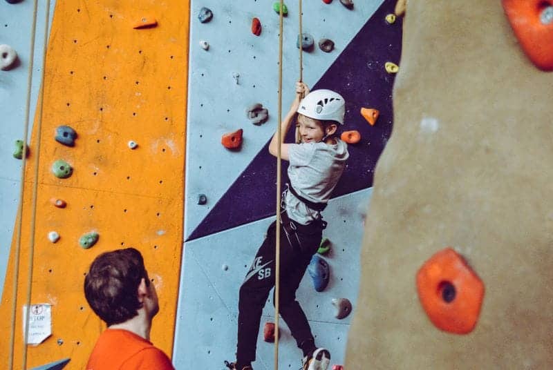 child on climbing wall