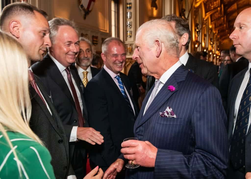 King Charles greeting guests at Royal Reception