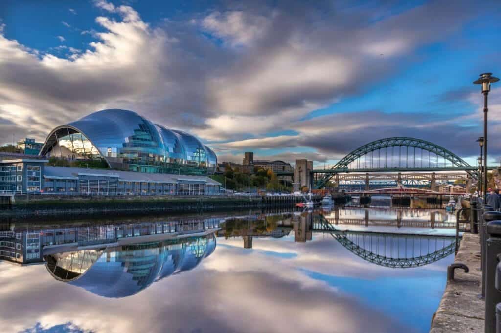 city river with bridge and buildings