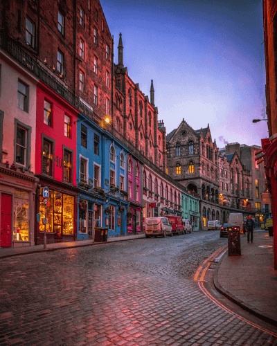 colourful buildings in street at dusk
